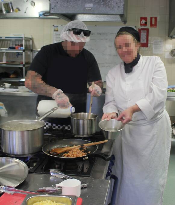 LEARNING: Offenders participating in a catering course. Their identifies have been concealed at the request of Corrective Services NSW. Picture: CSNSW