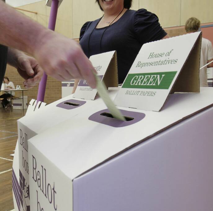 DECISION: An elector casts their vote at Rutherford during the 2013 federal election. Picture: MAX MASON-HUBERS