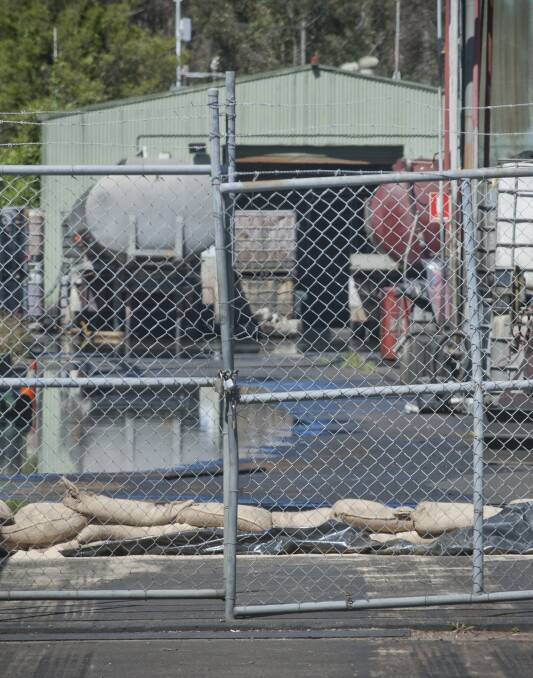 SPILL: A picture of what Fairfax Media understands to be an oil slick behind sandbags at Australian Waste Oil on Wednesday. Picture: Perry Duffin