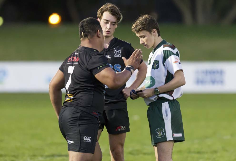 SENT OFF: Maitland breakaway Mark Meafua (left) is about to be issued a yellow card by referee Nik Gaal. Picture: Stewart Hazell 