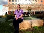 University of Newcastle midwifrey student Paige Smith at Maitland Hospital post-shift. Picture by Peter Lorimer