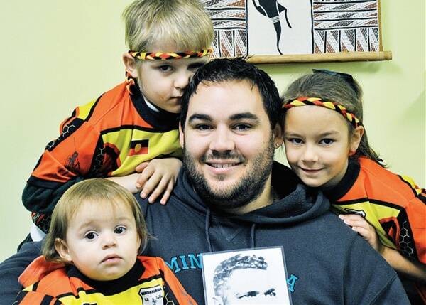 PROUD FAMILY: Guy Patten with a picture of his great, great grandfather and children Jamahli, 1, Jack, 6, and  Kyana, 7.