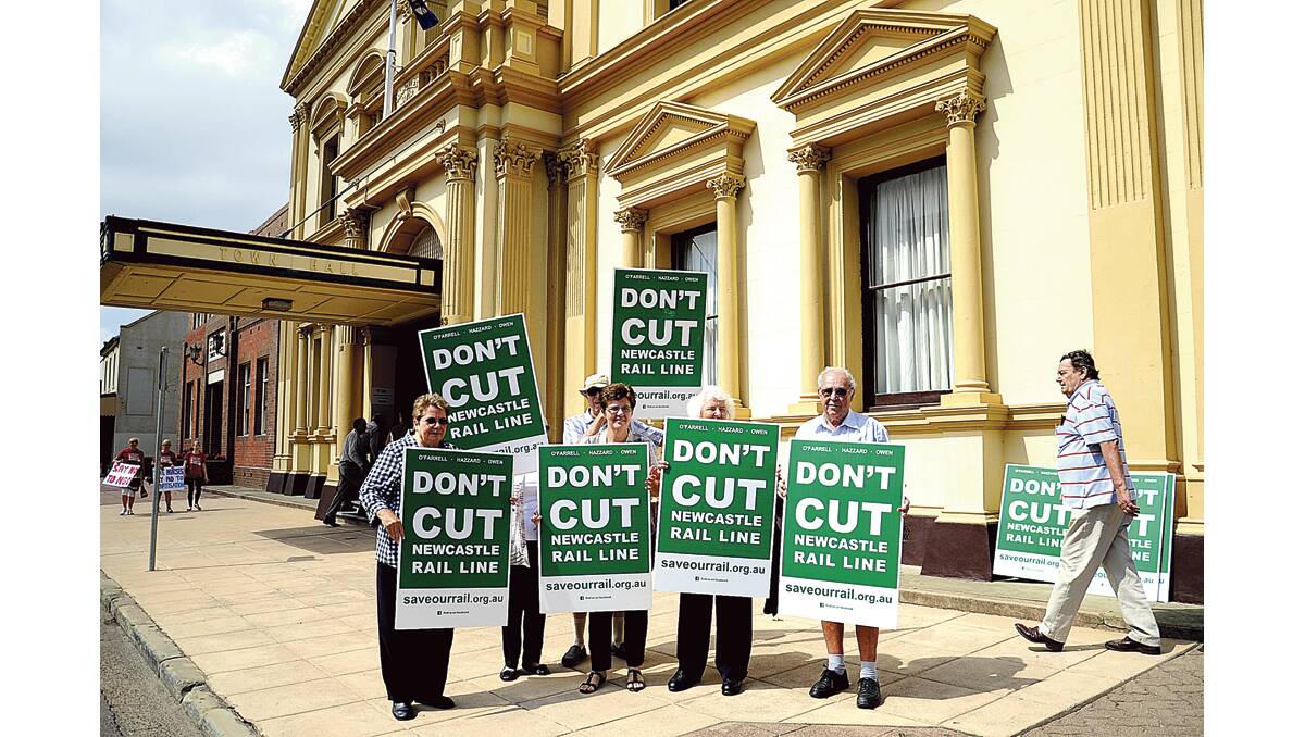 NOT HAPPY, PREMIER: Protesters wanting the Newcastle rail line retained in its entirety.  