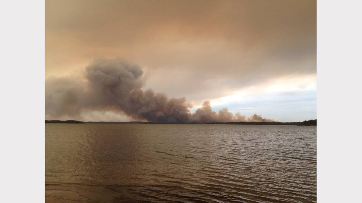 Doyalson fire from Myuna Bay, Thursday. Picture James Black