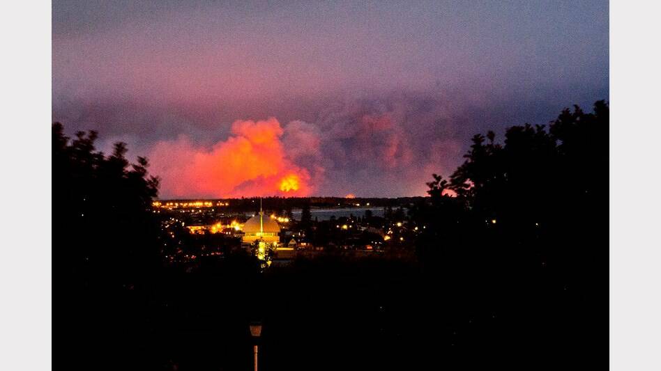 HELL ON EARTH: A shot of the Port Stephens fires as seen from Newcastle's Christ Church Cathedral. Photo by Mark Snelson