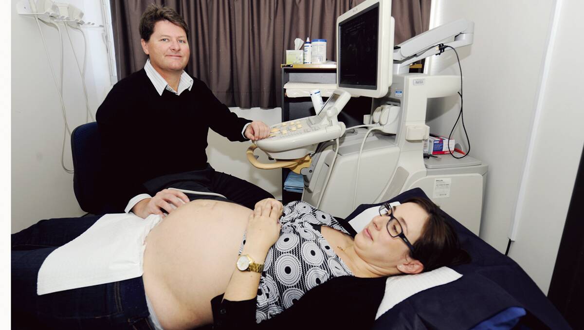 BENEFITS:  Green Hills X-ray and Ultrasound director Peter Sylow conducts an ultrasound with patient Ann-Maree Humprhies, of Raworth, who is 32 weeks pregnant. 