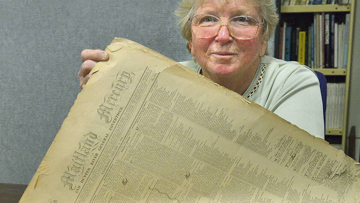 ‘rare as hens’ teeth’:  Ruth Trappel of the Maitland Historical Society with copies of the Maitland Mercury from the mid-1800s.  	Picture by Stuart Scott