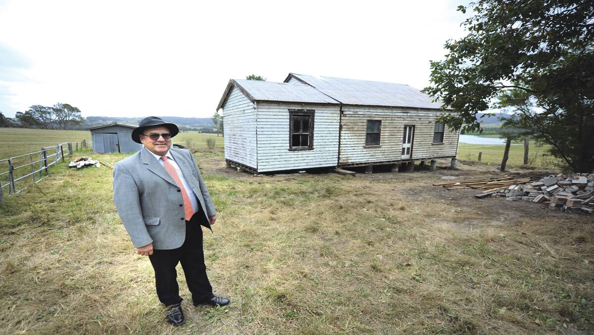 BACK TO ITS ORIGINAL SITE:  Tocal principal Cameron Archer and the Daly Kidd Cottage. 	Picture by MARINA NEIL