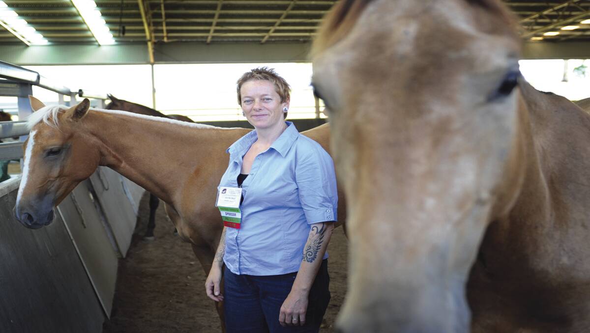 HORSE SENSE:  Mental health professional Jen Black is using horses in the treatment of people with mental health ­problems.   	Picture by MARINA NEIL 031212MN088 