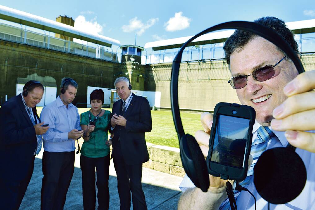 TUNED IN:  Maitland Gaol co-ordinator Gordon Sauber (front), mayor of Maitland Peter Blackmore, production development officer William Stuart, Maitland MP Robyn Parker and Tourism Minister George Souris try out the new audio tour at Maitland Gaol yesterday.  	Picture by STUART SCOTT