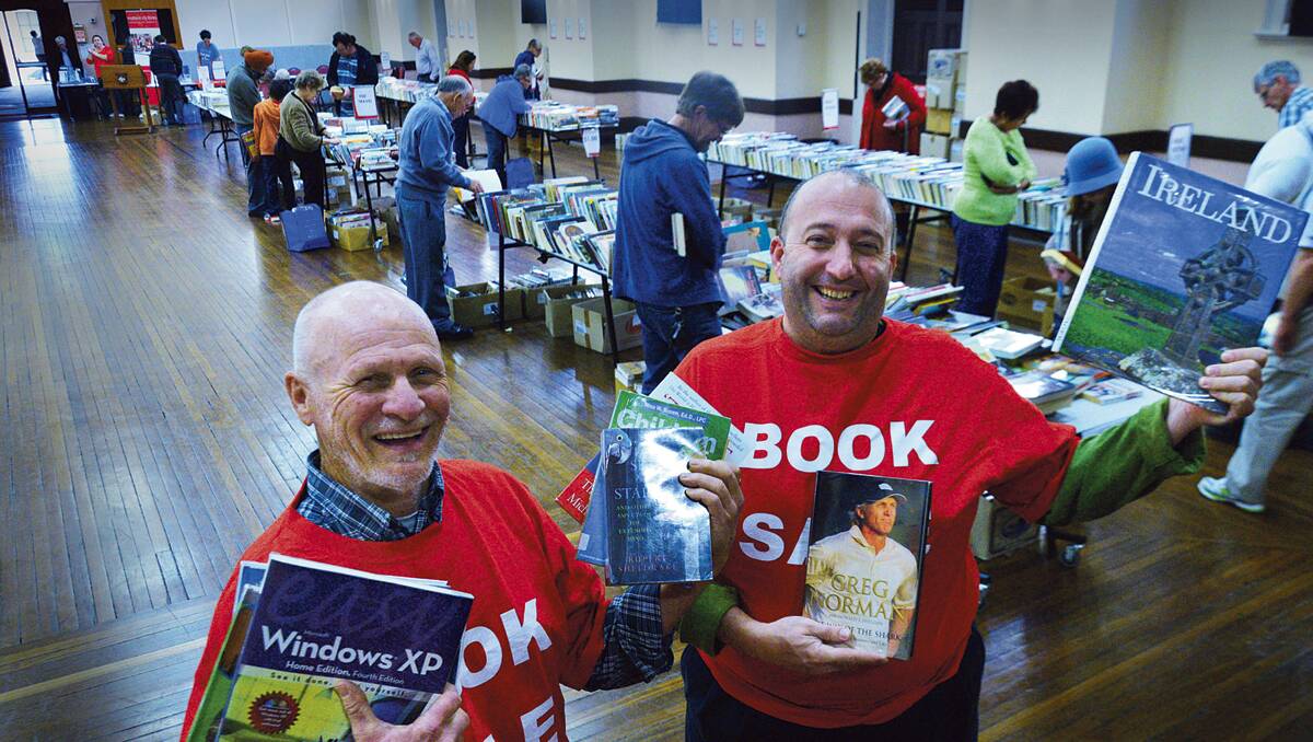 PAGE TURNERS: Friends of the Library John Brown and Samy Korbi with some great reading.   