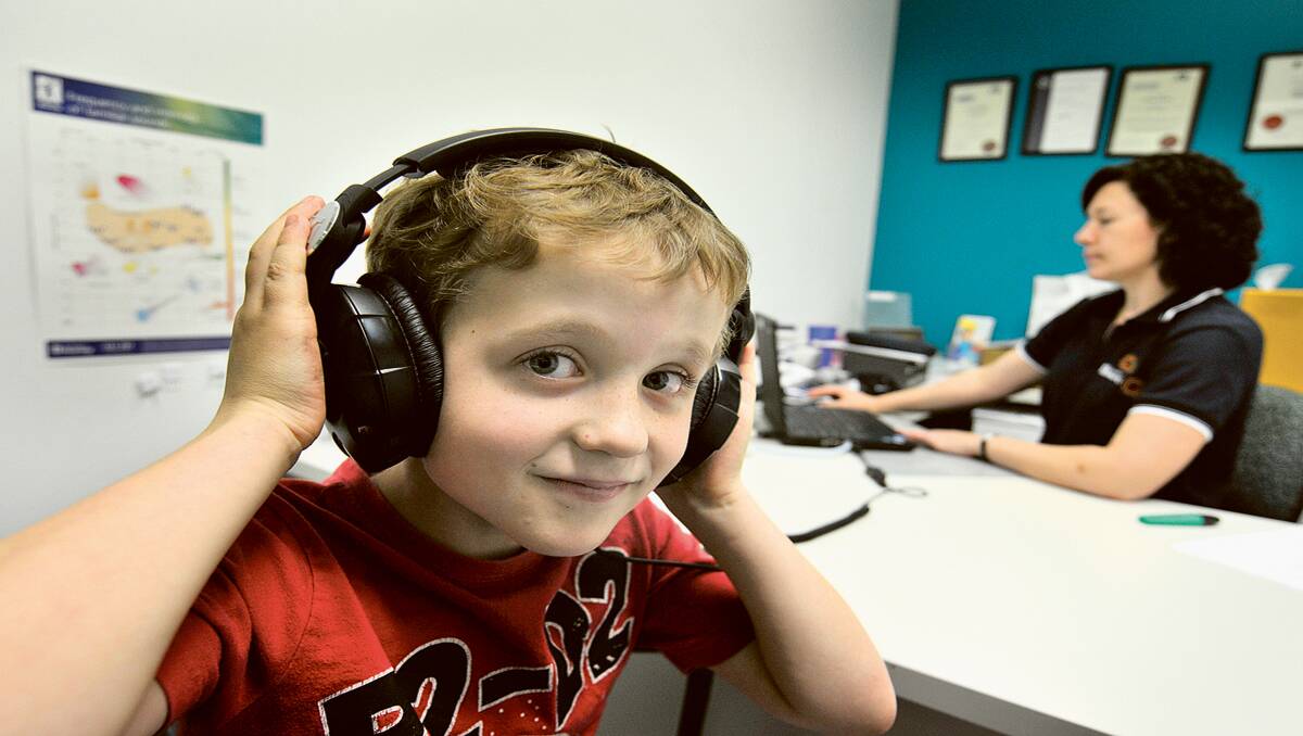 SOUND ADVICE:  D’arcy Cooper, 6,  with audio specialist Amanda Buckles.                                                                                                                                                                 Picture by CATH BOWEN