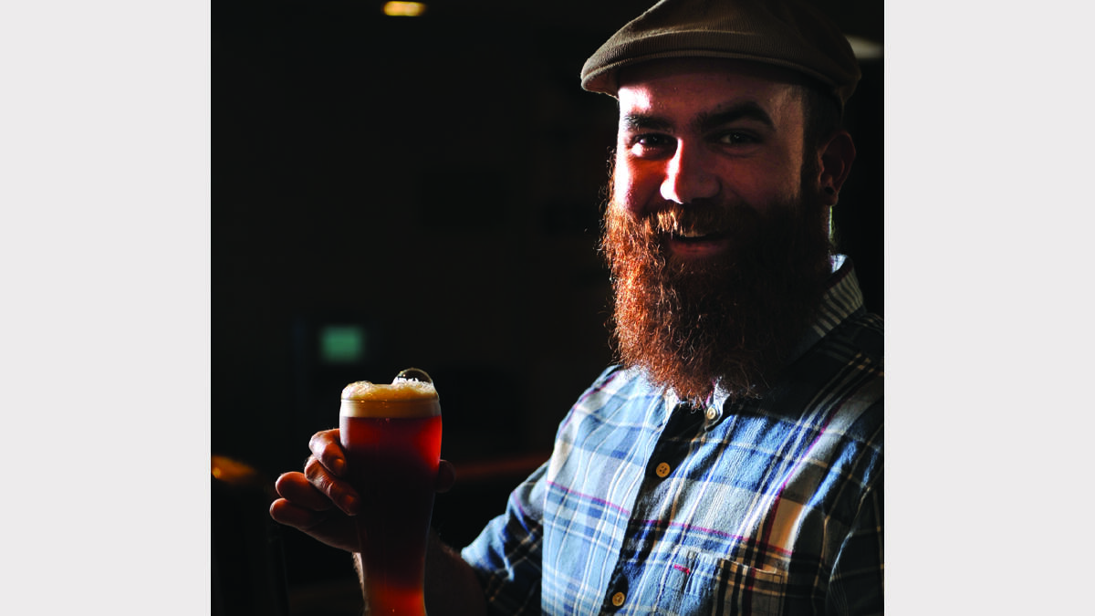 HEADS UP:  Commercial Hotel manager Jayse Tasker with the new beer.    Picture by MARINA NEIL 	