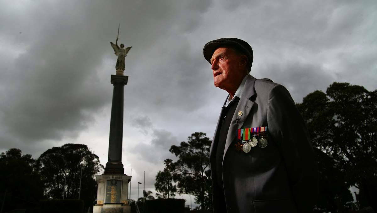 REMEMBER: John Fenwick, of East Maitland, at Maitland cenotaph and, inset, his father, also called John. Picture: Peter Stoop