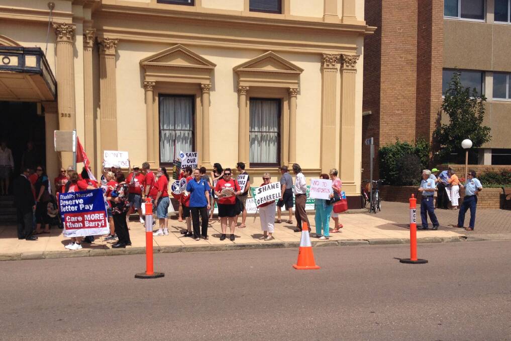 Protesters stationed outside the community cabinet meeting in Maitland. Pic: CATH BOWEN