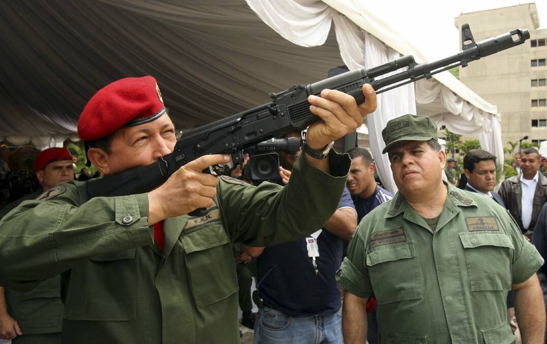 Venezuela's President Hugo Chavez holds a new Russian Kalashnikov assault rifle in June, 2006. Photo: REUTERS