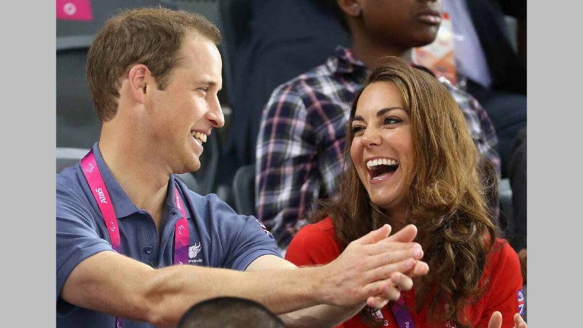 Prince William, Duke of Cambridge and Catherine, Duchess of Cambridge share a joke as they clap whilst watching the track cycling on day 1 of the London 2012 Paralympics. Picture: Getty Images