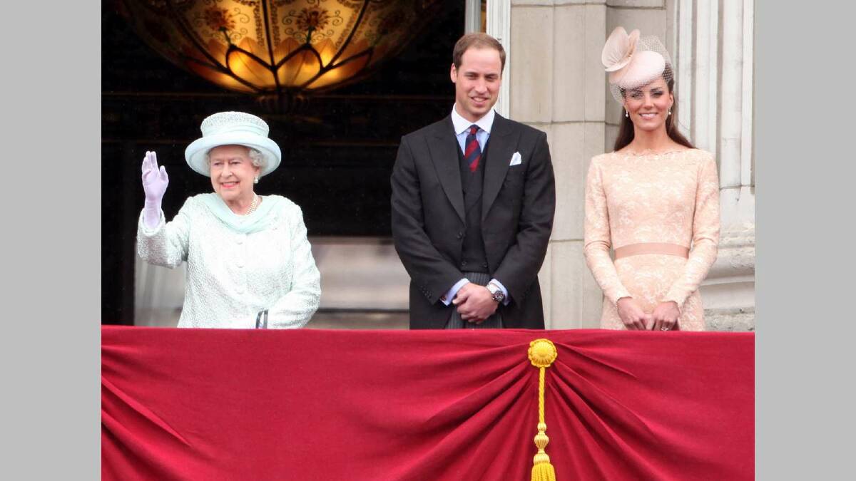 Queen Elizabeth II, Prince William, Duke of Cambridge and Catherine, Duchess of Cambridge wave to the crowds from Buckingham Palace during the Diamond Jubilee carriage procession in June 2012. Picture: Getty Images