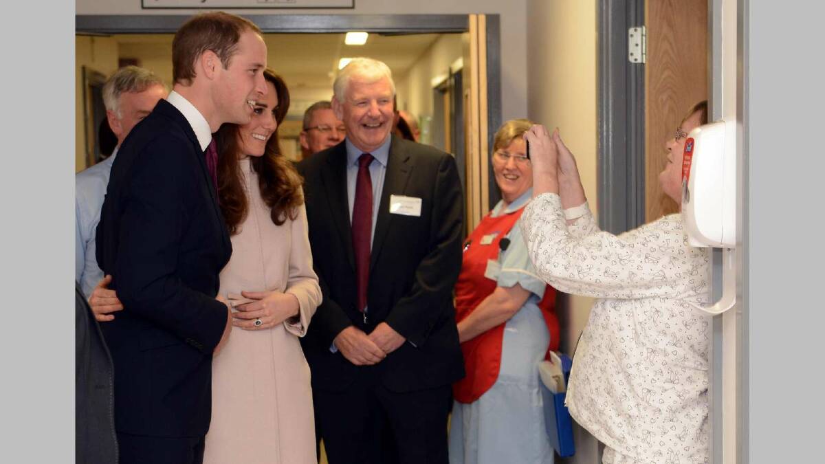 Prince William, Duke of Cambridge and Catherine, Duchess of Cambridge pose for patient Mrs.Linda Smith at Peterborough City Hospital during an official visit in November 2012. Picture: Getty Images