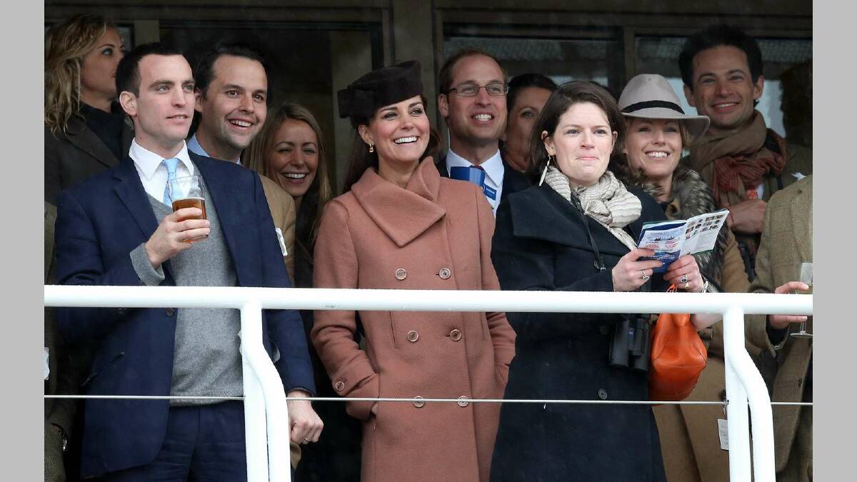 Catherine, Duchess of Cambridge and Prince William, Duke of Cambridge watch the races with other racegoers on Gold Cup Day at Cheltenham Racecourse in March. Picture: Getty Images