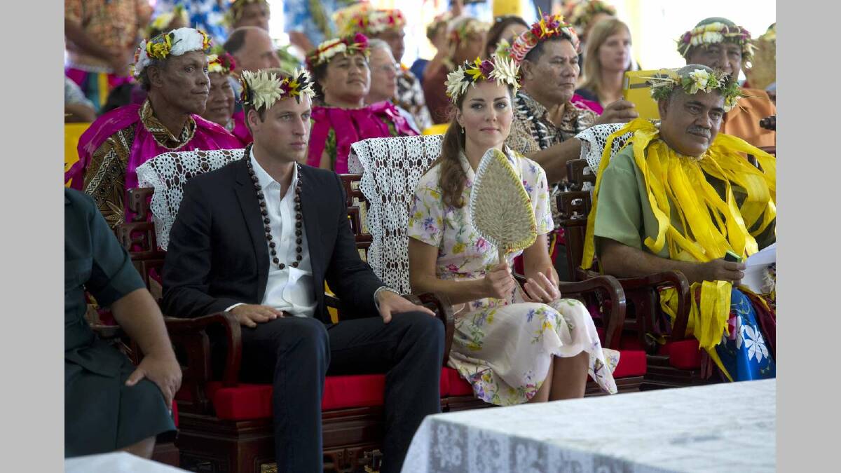 Prince William, Duke of Cambridge and Catherine, Duchess of Cambridge are given gifts as they bid farewell on September 19, 2012 in Tuvalu.  Picture: Getty Images