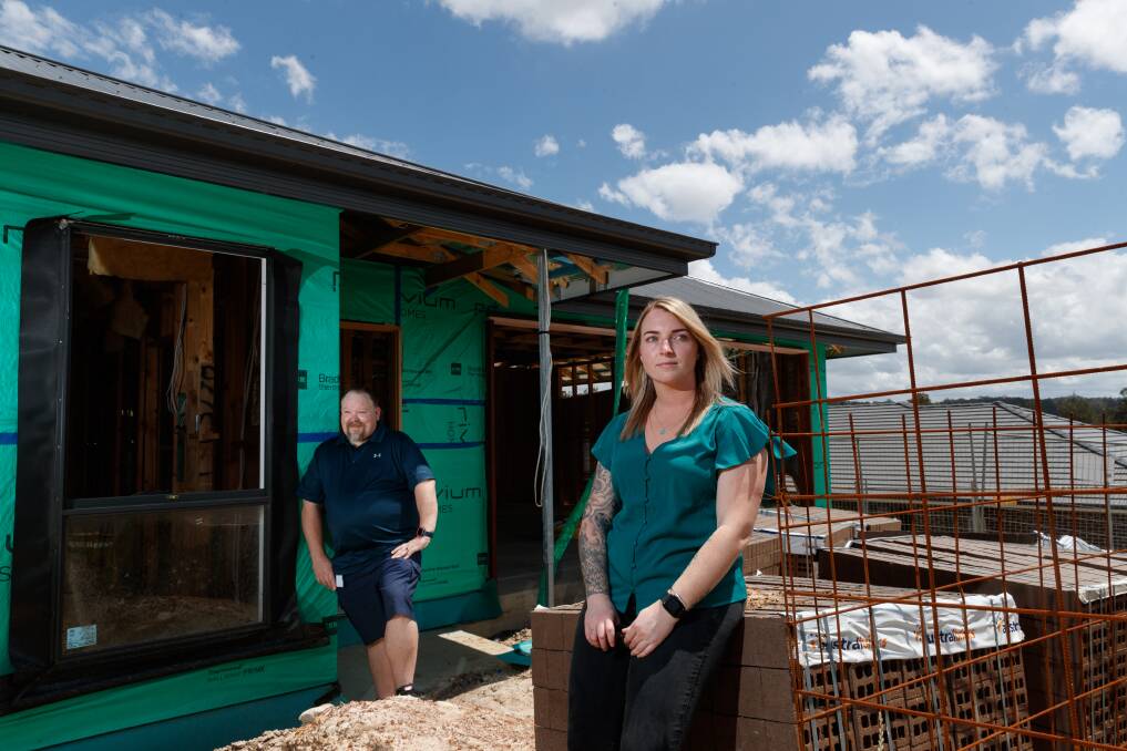 ABANDONED SITE: Nathan Whyte-Southcombe and Kiana Johnston whose Privium Homes build sites at Heritage Parc, Rutherford, have been abandoned since tradies downed tools on Friday, November 11. Picture: Max Mason-Hubers