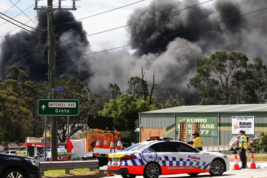 Black plumes of smoke pour out from Weston Aluminium buildings on fire at the Mitchell Avenue industrial complex at Kurri Kurri which started in a pallet of handsanitiser. Pictures: Peter Lorimer