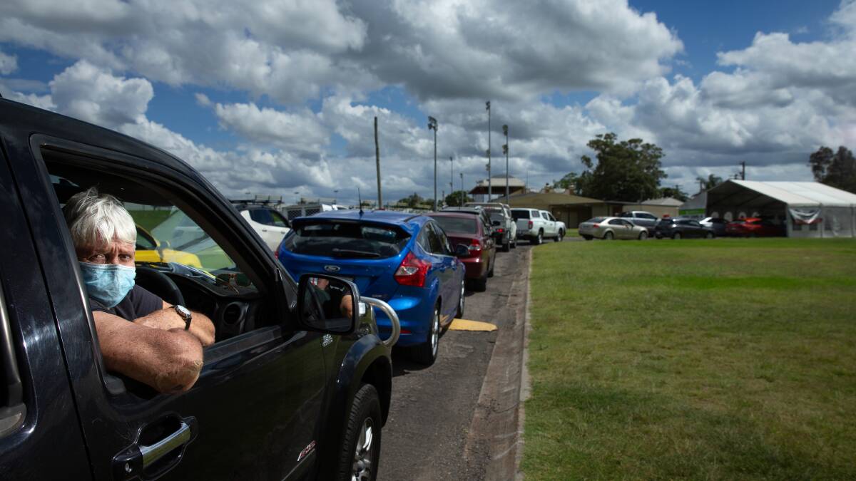The queue for a PCR COVID-19 test at the Maitland Showground test clinic started banking up before 7am, and the gates were locked at 12noon, after which time security staff said they turned away 500 cars. Pictures: Marina Neil