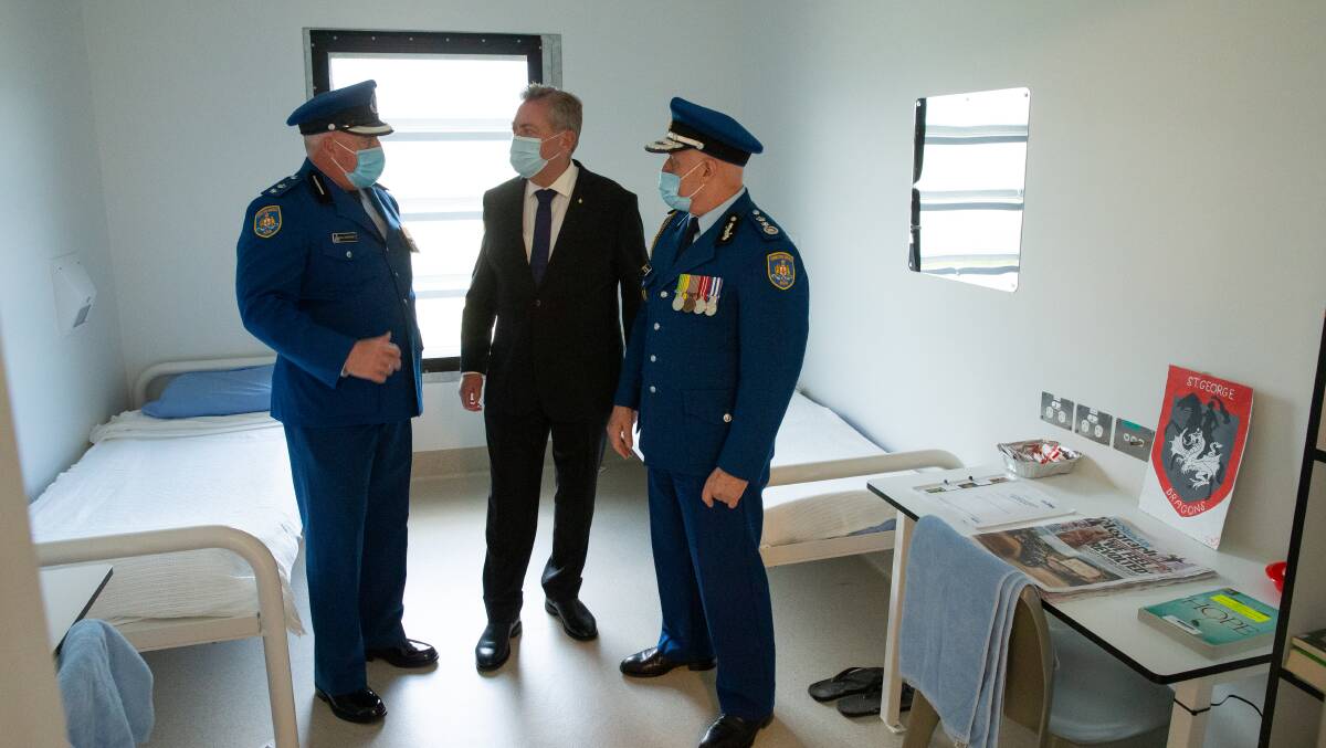 Brand new: Acting Governor Dale Ashcroft , Minister for Counter Terrorism and Corrections Anthony Roberts and Acting Commissioner Kevin Corcoran in one of the new rooms at the Cessnock facility Picture: Marina Neil 