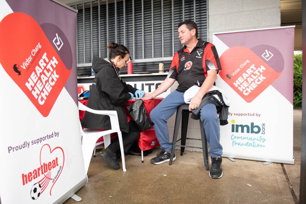Easy test: Victor Chang Cardiac Research Institute nurse checking the heart health of an Edgeworth Eagles FC supporter.