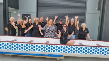 Hunter River Dragons members with Jenny Aitchison MP and their new race boat. Picture supplied