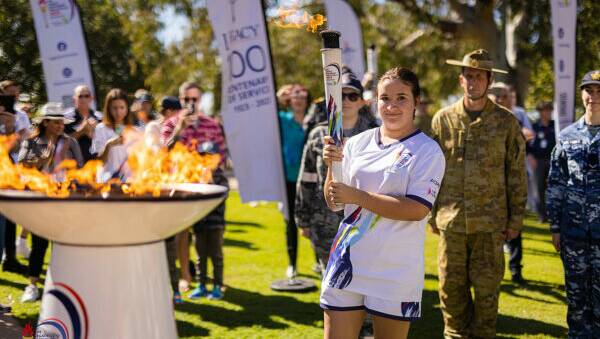 An Australian torch bearer at a Queensland cauldron lighting ceremony. Picture Legacy.