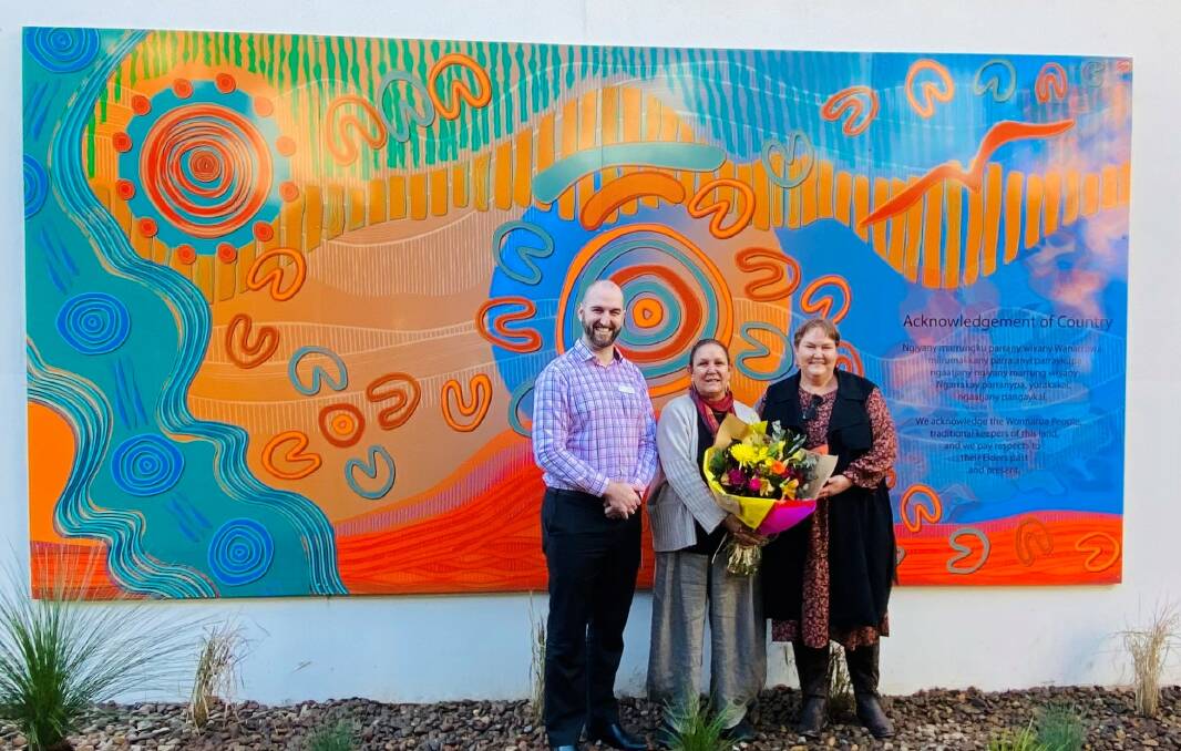 WELCOMING: Maitland Private Hospital CEO Peter Cizzio, artist Saretta Fielding and Mindaribba Land Council CEO Tara Dever at the mural's unveiling. Picture: Supplied.