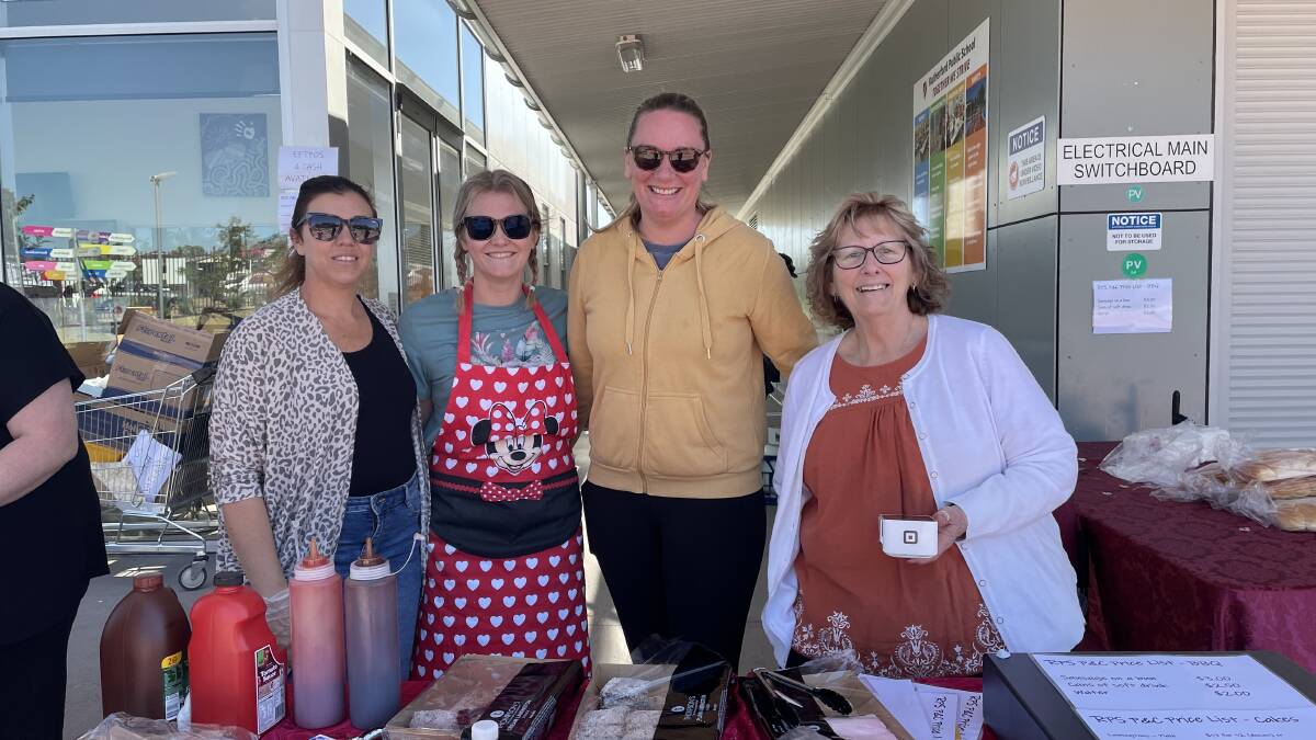 Rutherford P&C association volunteers Kristy McConnell, Mel Buscombe, Nicole Lee and Kim Shaw are selling a huge variety of food including a full lolly table, vanilla slices, lamingtons, sausages on buns and cans of drink. Picture by Chloe Coleman
