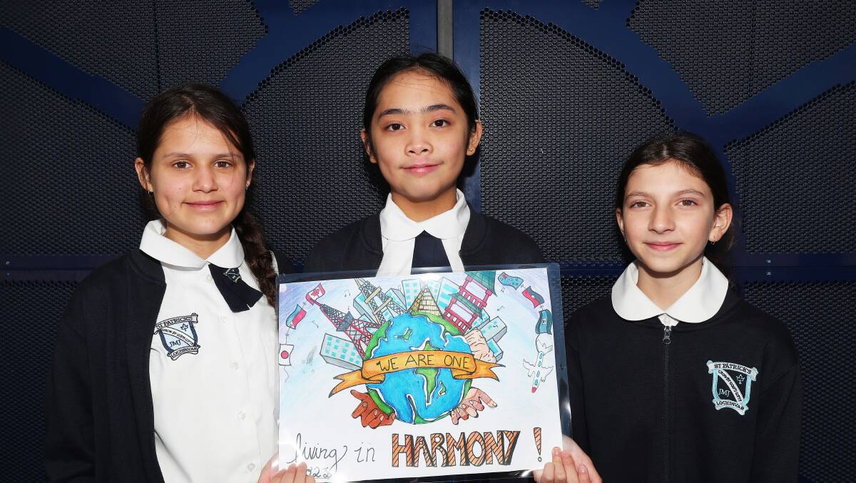 St Patrick's Primary School, Lochinvar year six students and Northern NSW Harmony Day Poster regional winners Ivy Chavez, Kaitlyn Babaran and Scarlett Whybrow. Picture by Peter Lorimer.