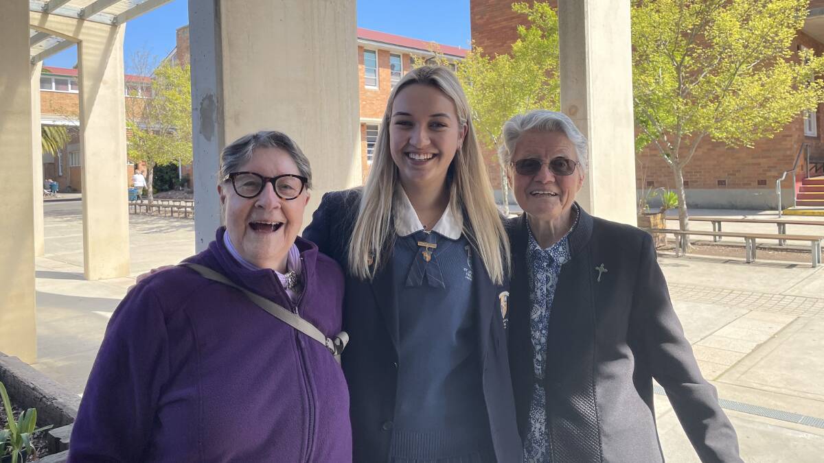 Sisters Patricia Bowland and Marie Jones who started as nuns together on the same day in 1960 with St Joseph's College, Lochinvar captain Emma Phelan. Picture by Chloe Coleman