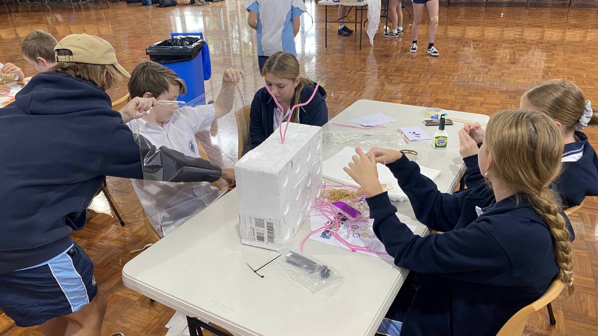 Students hard at work on their solution to ease space travel for astronauts. Picture: Supplied.