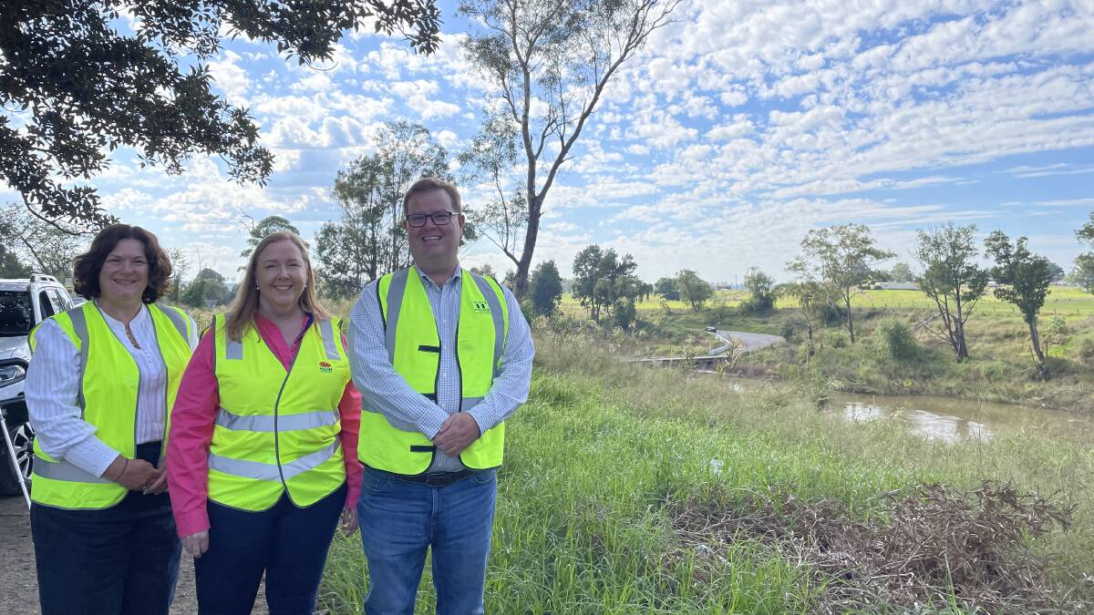 Member for Paterson Meryl Swanson, member for Maitland and minister for Regional Transport and Roads Jenny Aitchison and Maitland mayor Philip Penfold with Melville Ford Bridge in the background. Picture by Chloe Coleman