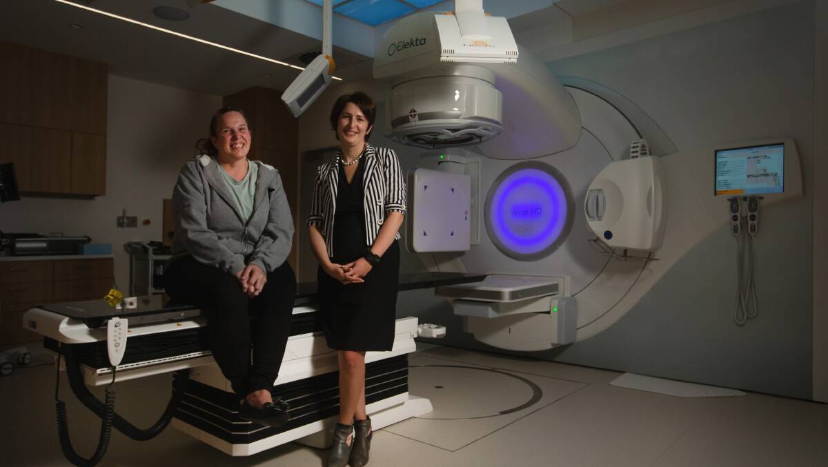 GAME-CHANGING: Patient Kathleen Tanner and radiation oncologist at GenesisCare Maitland Dr Eka Moseshvili with the radiation therapy machine. Picture: Marina Neil.
