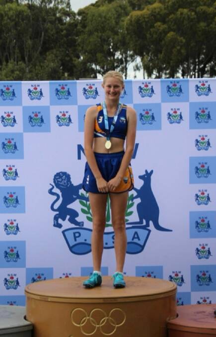Mikayla Whaler on the podium with her gold medal. Picture supplied.