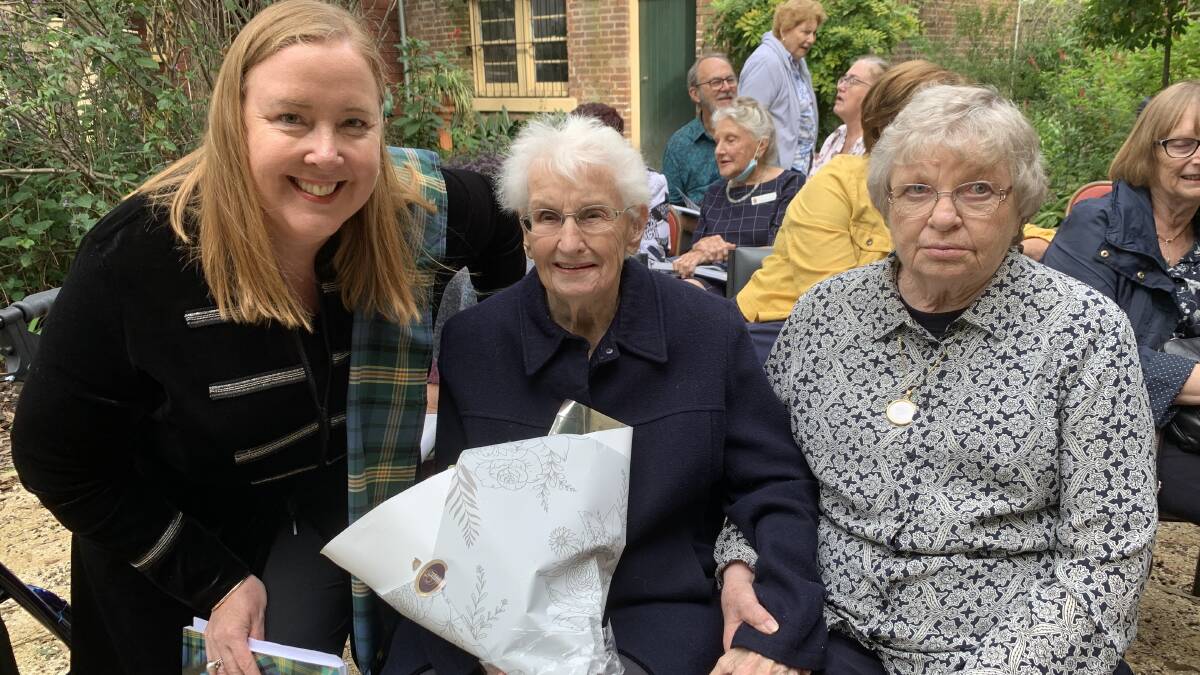 LONG SERVING: Jenny Aitchison MP with the band's longest member, Shirley Wilson, who joined in 1952, and Marie Messmer, the wife of the late drum major Joe Skinner. Picture: Supplied.