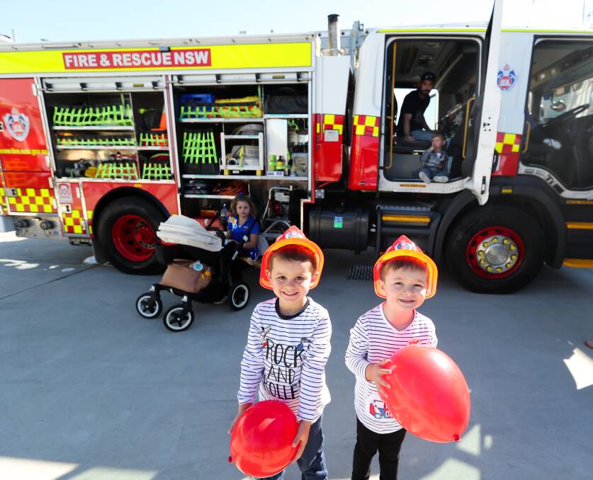 Ruben Day and Jasper Clarke at a past Fire and Rescue NSW open day. Picture by Jonathan Carroll.