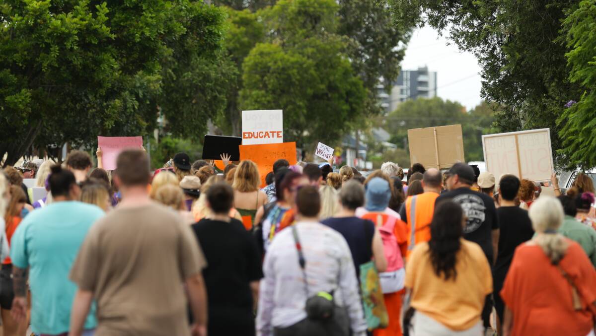 Attendees of a march against domestic violence in Newcastle. Picture by Jonathan Carroll