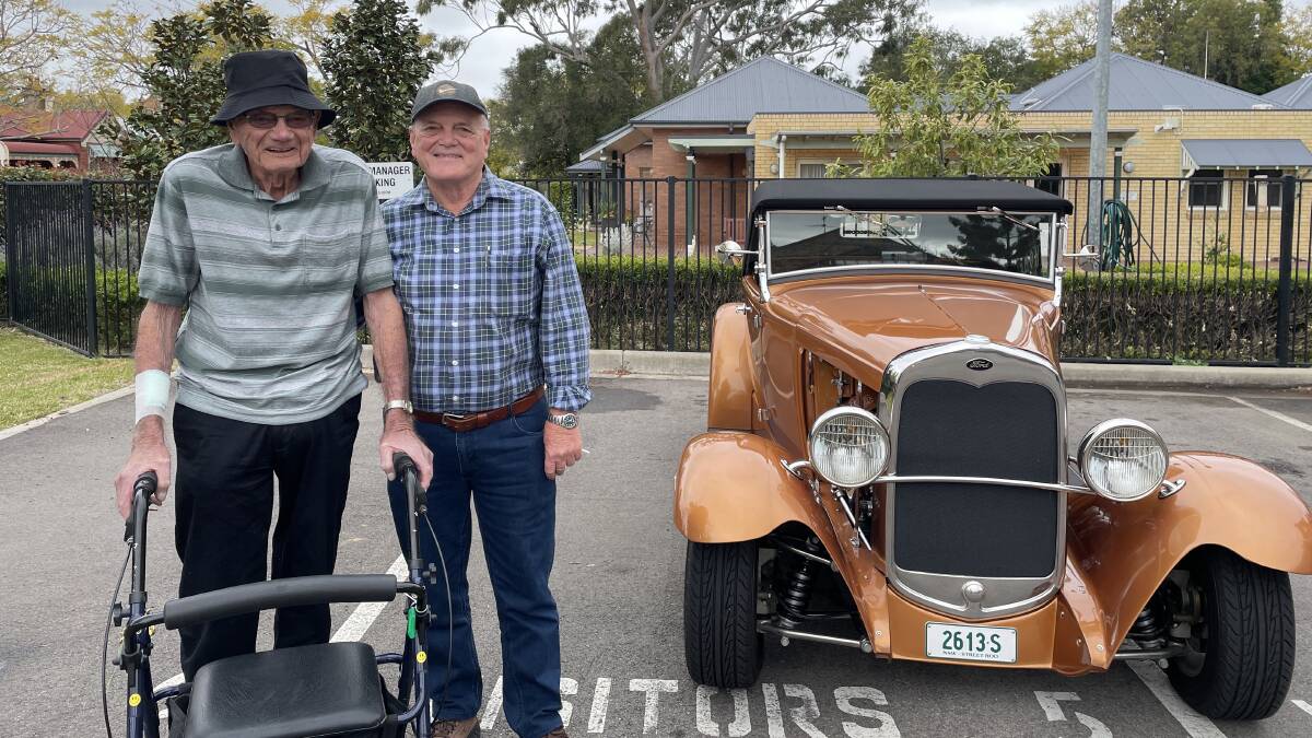 Malcolm and Max Crouch at Benhome's Father's Day classic car show. Picture by Chloe Coleman