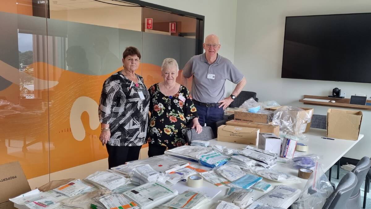DEDICATED: Trevor Lynch, chair of Maitland Health Committee, Eve Harwood vice president of Maitland Hospital Volunteers and Marilyn Guganovic, volunteer at Maitland Hospital spent days packing the supplies. Picture: Supplied.