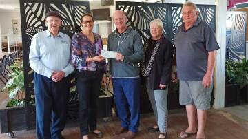 HELPING HAND: President of EMBC Bill Hopkins (left) and CEO Steve Duggan (middle) with representatives of Coraki Memorial Bowling Club, most of which is still closed because of the damage. Picture: Supplied.