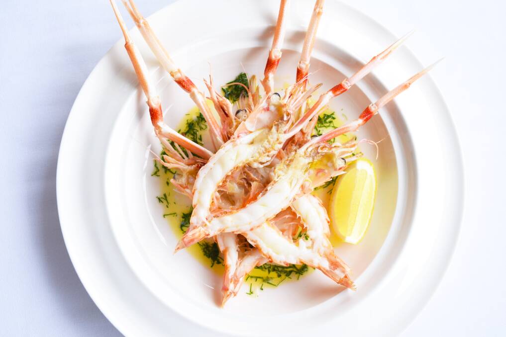 Scampi butterflied and baked, topped with a lemon, garlic and butter sauce is among the dishes on Pescara's menu at Hermitage Lodge, Pokolbin. 