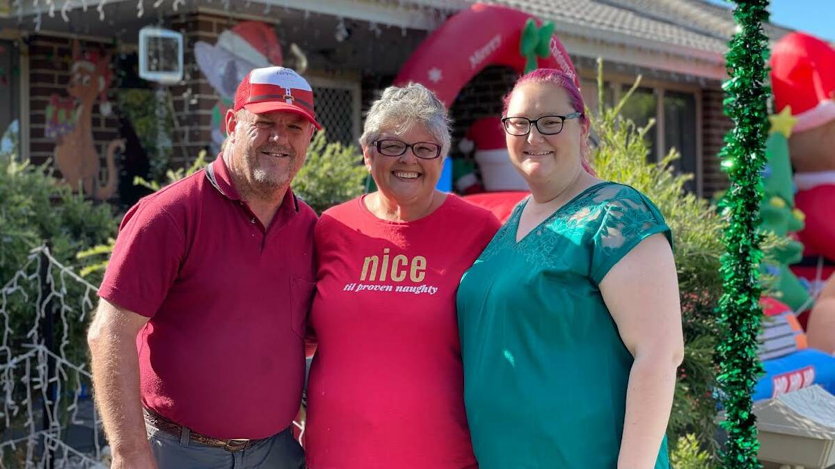 Bella Johnston (middle) and her good friends David McGrath (left) and Jamie Kent (right) have been busy getting Bella's Rutherford home ready for their annual children's Christmas party. Picture by Laura Rumbel 