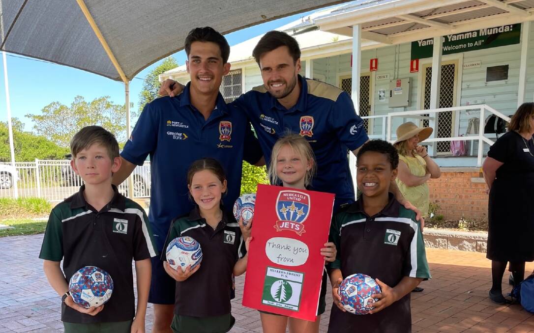 Millers Forest Public School students with Newcastle Jets players Archie Goodwin and Carl Jenkinson. Picture supplied