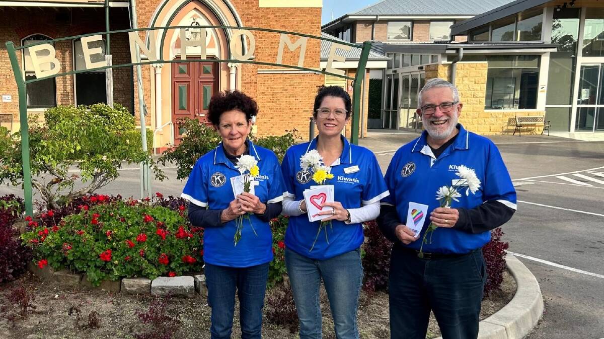 Left to right, Kiwanis members Jenny Swanson, Anna Swanson and Andrew Swanson delivering flowers to residents at Benhome on Mother's Day. Picture supplied
